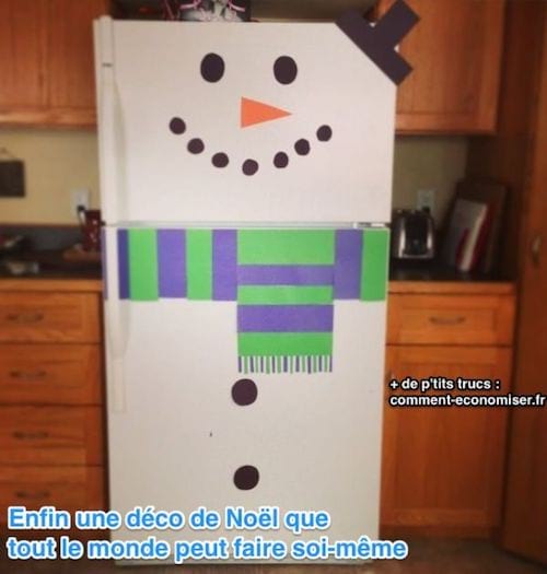 Un frigorífico decorado como un muñeco de nieve.