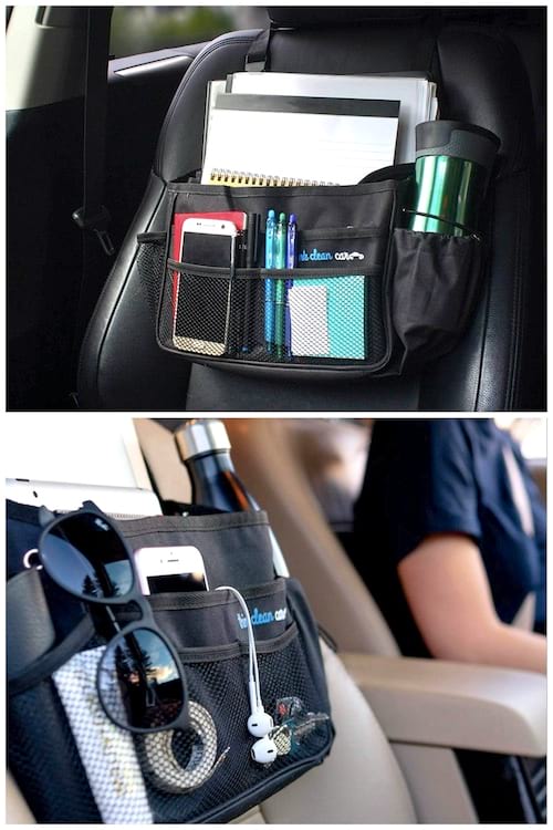 Un espacio de almacenamiento en el asiento delantero del automóvil con un teléfono, una botella de agua y otros artículos.