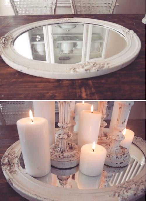 bílé zrcadlo a dekorativní svíčky