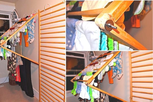 Un perchero de madera montado en la pared que se pliega y se despliega fácilmente para secar la ropa.