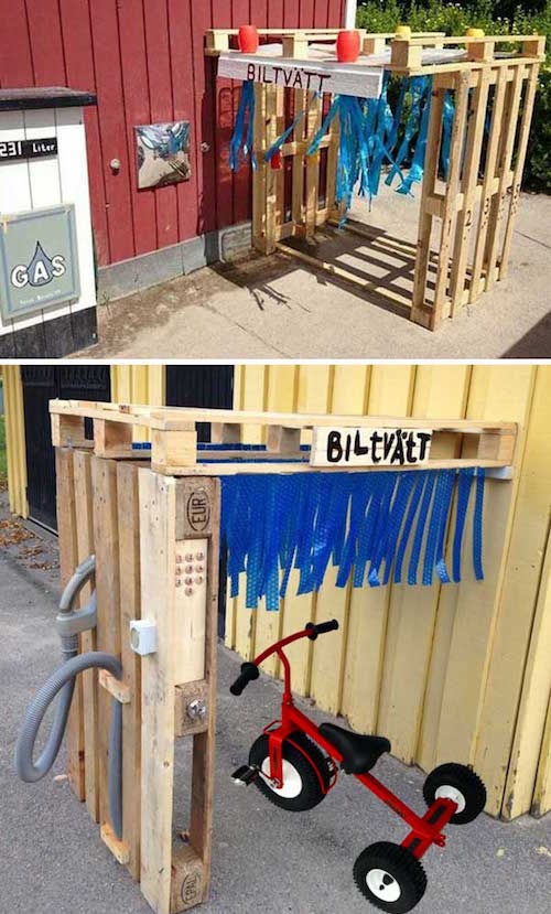 una estació de rentat de tricicles construïda amb palets