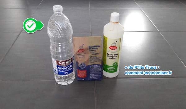 Ingredients of homemade tile cleaner with white vinegar, baking soda and black soap
