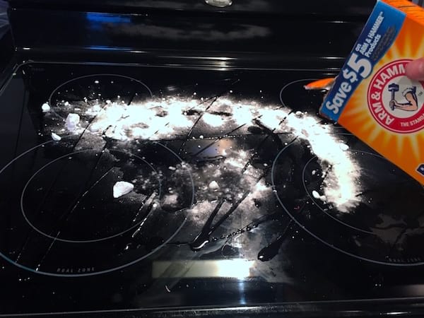 a baking sheet covered with baking soda, hydrogen peroxide and washing up liquid