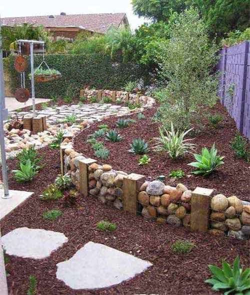 Per a una bonica vora de jardí, utilitzeu gabions o bastidors de filferro, plens de grans pedres.