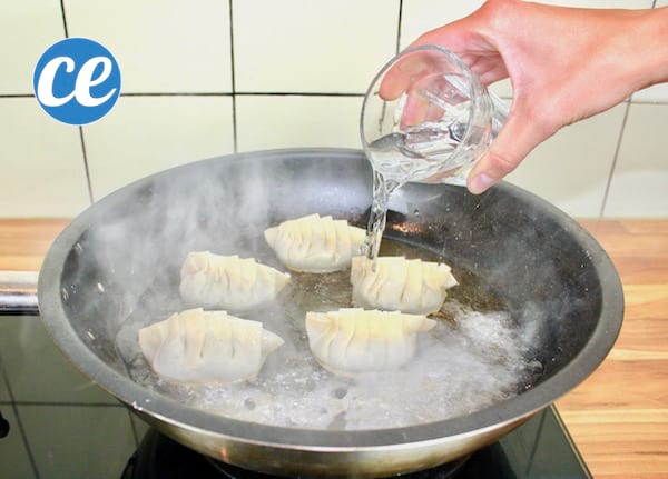 Add a little water to the pan with the gyozas.